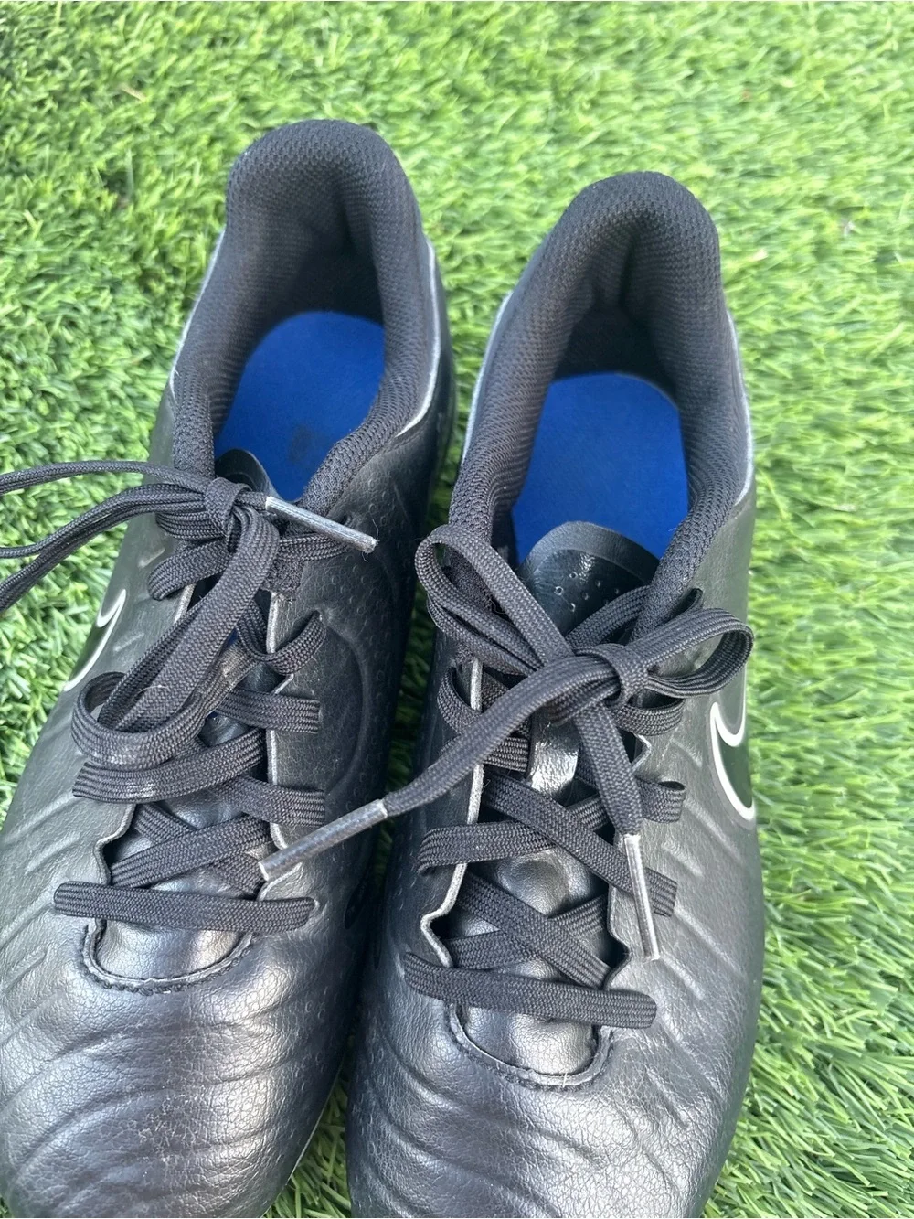 Nike Kids Black Soccer Cleats with Blue Accents